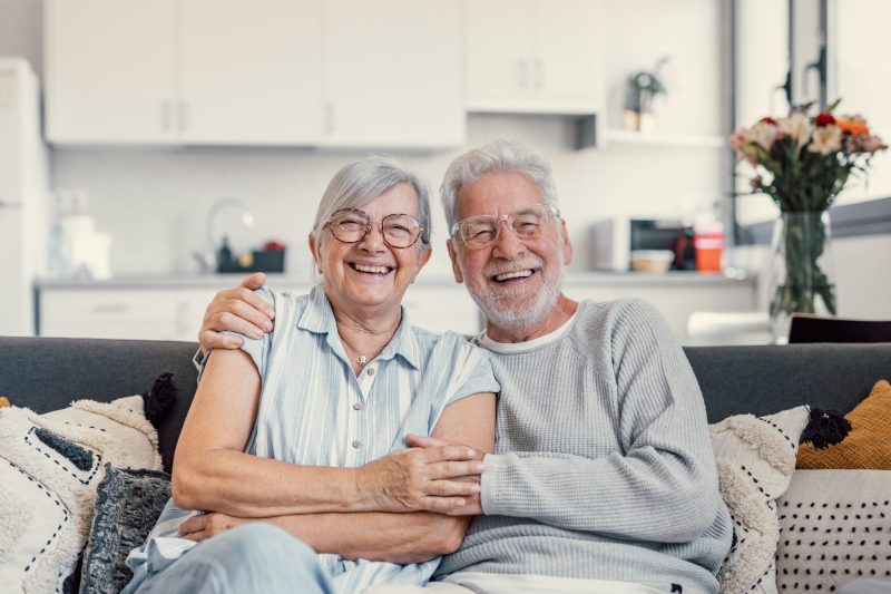 Happy elderly couple at home